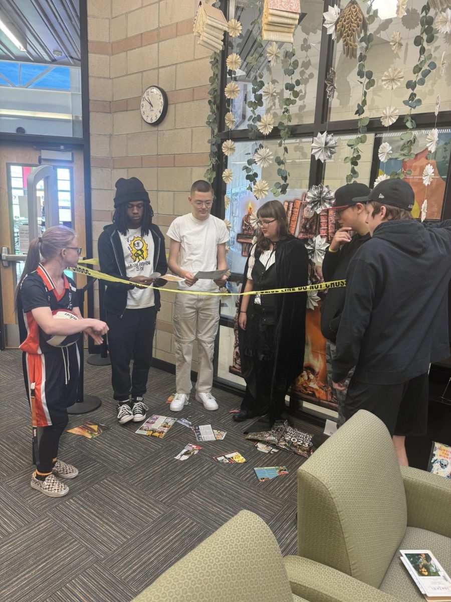 Triumph students gathering clues to solve the mystery.